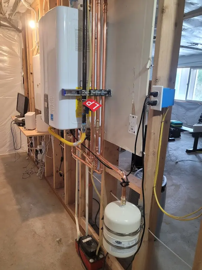 Licensed plumber repairing a kitchen sink in Leonia