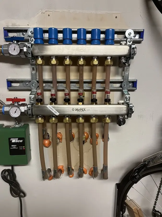 Plumber performing Water Heater Repair at a residential property in Leonia